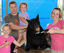 family photo with bear cub