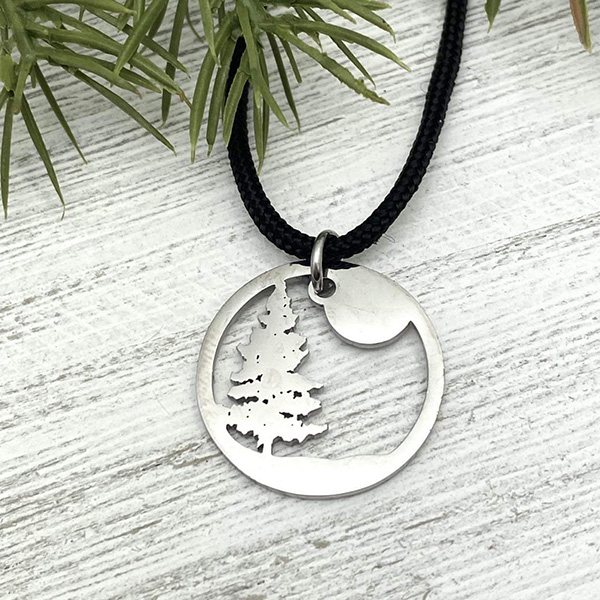 silver tree silhouette in circle pendant
