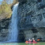 kayakers at the base of spray falls